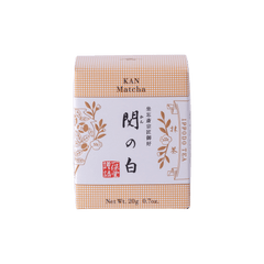 New unopened peach box of Ippodo Tea Co. Kan matcha powder with Japanese characters and gold leaf flowers embossed