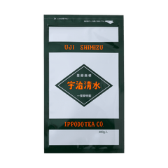Grey and black large bag of Ippodo's Uji-Shimizu sweetened matcha tea powder with red font Japanese characters