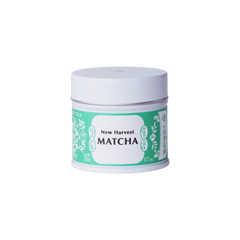 Unopened tin of New Harvest Matcha with iconic Ippodo tea pot and floral design in bright green against white background