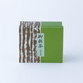 Box half green and half brown tree bark design with black Japanese text 'Omeicha Ippodo' - thumbnail 6