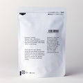 Back of white 100g bag of Ippodo Ikuyo matcha showing English brewing instructions, nutritional information and ingredients