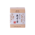 Unopened box of Ippodo Tea Co. Ikuyo matcha powder with peach color hashmarks, Japanese characters and gold flowers leaves