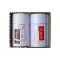 Green tea canister gift set with two white cans with white and red Japanese writing set inside green and brown decorative box - thumbnail 1