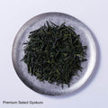 Loose leaf dark green rolled dried Ippodo Gyokuro premium Japanese green tea on silver plate - thumbnail 2