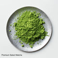 Loose green finely ground milled Japanese Ippodo Premium Select Matcha tea powder on silver plate on white table - thumbnail 2