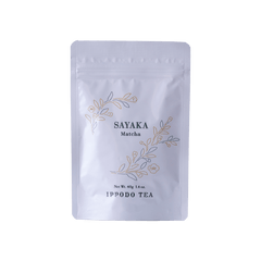 White resealable 40 gram bag of Ippodo Sayaka matcha with gold and green floral design and text