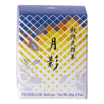 Front view of unopened tea box with blue and yellow geometric pattern, flowers and Japanese and English text