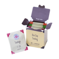 Open box of Ippodo One Cup Teabag packets with an individual gyokuro tea bag packet in front on a white background. - thumbnail 1