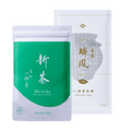 Bright green and white pouch of Uji Shincha tea white Japanese writing beside white and olive green package of Rimpo gyokuro