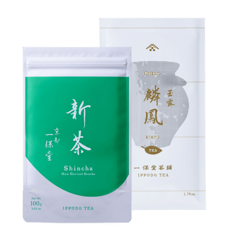 Bright green and white pouch of Uji Shincha tea white Japanese writing beside white and olive green package of Rimpo gyokuro