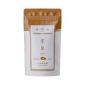 White packaging with bronze faux-painted details of Hosen Sencha classic Japanese green tea 80g bag by Ippodo Tea Co.