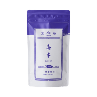 White packaging with indigo violet faux-painted details of Kaboku Sencha prized Japanese green tea 80g bag by Ippodo Tea Co.