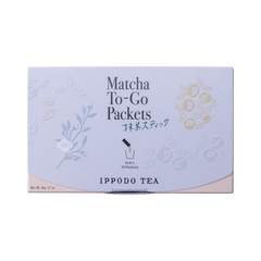 Slim peach color box of Matcha-To-Go Packets with light grey flap to open on front with faint multicolored flowers petals