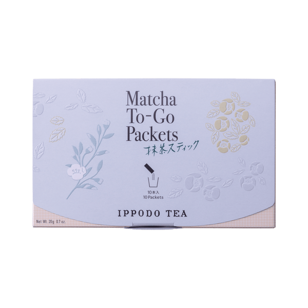 Slim peach color box of Matcha-To-Go Packets with light grey flap to open on front with faint multicolored flowers petals