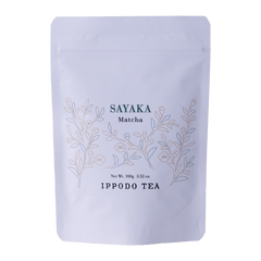 White resealable 100 gram bag of Ippodo Sayaka matcha with gold minimalist floral design