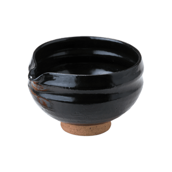 Artisan-made ceramic speckled black matcha tea bowl with hand groove and serving spout made from Mino-yaki Japanese clay