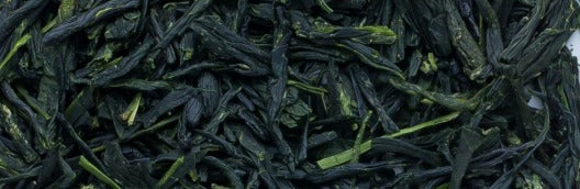 Deep green needle-shaped gyokuro tea leaves